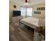 Main bedroom with king-size bed and large windows at 2268 Essex Dr. # G, Surfside Beach, SC 29575