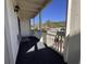 Covered patio with outdoor furniture, with a partial view of the building's exterior at 2805 N Ocean Blvd. # 107, Myrtle Beach, SC 29577