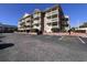 Spacious condo building featuring multiple balconies and ample parking at 2805 N Ocean Blvd. # 107, Myrtle Beach, SC 29577