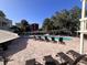 Outdoor pool area with lounge chairs, tables, and umbrellas for relaxation at 2805 N Ocean Blvd. # 107, Myrtle Beach, SC 29577