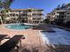 Community pool and hot tub surrounded by lounge chairs at 2805 N Ocean Blvd. # 107, Myrtle Beach, SC 29577