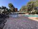 Outdoor community pool and hot tub with lounge chairs on the brick deck at 2805 N Ocean Blvd. # 107, Myrtle Beach, SC 29577