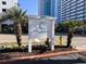 The Chelsea House Villas sign with vibrant landscaping and street view at 2805 N Ocean Blvd. # 107, Myrtle Beach, SC 29577