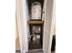 A utility closet contains a hot water tank and HVAC unit at 2805 N Ocean Blvd. # 107, Myrtle Beach, SC 29577