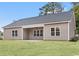 A sprawling backyard with a covered patio perfect for outdoor relaxation and entertainment at 608 Britt St., Georgetown, SC 29440