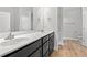 Bright bathroom featuring a white countertop, dark cabinets, and a modern sink at 608 Britt St., Georgetown, SC 29440