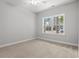 Cozy bedroom featuring a large window with natural light and neutral carpet at 608 Britt St., Georgetown, SC 29440