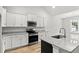 Bright and modern kitchen featuring stainless appliances, granite counters, and ample cabinetry at 608 Britt St., Georgetown, SC 29440