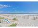View of sandy beach with the ocean, sand fences, and vegetation in the foreground at 1501 Ocean Blvd. S # 422, Myrtle Beach, SC 29577