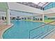 Large indoor swimming pool with water feature and ample seating, skylight ceiling above at 1501 Ocean Blvd. S # 422, Myrtle Beach, SC 29577