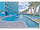 Exterior lazy river at resort with water features and palm trees in the foreground at 1501 Ocean Blvd. S # 422, Myrtle Beach, SC 29577