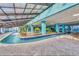 Indoor lazy river with palm trees and decor, covered with a glass skylight above at 1501 Ocean Blvd. S # 422, Myrtle Beach, SC 29577