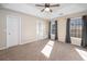 Spacious main bedroom with ceiling fan and ample natural light at 204 Monterrey Dr., Longs, SC 29568