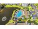 Aerial view of pool and community area, close to pond with fountain and lush landscaping at 3735 Block House Way # 113, Myrtle Beach, SC 29577