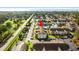 Aerial view showcasing community with pool, pond with fountain, manicured lawns, and close proximity to the beach at 3735 Block House Way # 113, Myrtle Beach, SC 29577
