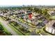 Aerial view of a condo complex near a beach and road with mature landscaping, ponds, and a pool at 3735 Block House Way # 113, Myrtle Beach, SC 29577