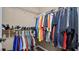 Organized walk-in closet with ample hanging space and shelving for clothes, shoes, and accessories at 3735 Block House Way # 113, Myrtle Beach, SC 29577