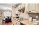 Bright kitchen features wooden cabinets, stainless steel sink, and breakfast bar, perfect for casual dining at 3735 Block House Way # 113, Myrtle Beach, SC 29577