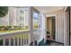 Private patio with storage closet, offering tranquil outdoor space with views of manicured lawn at 3735 Block House Way # 113, Myrtle Beach, SC 29577