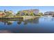 Scenic pond view of complex, complete with fountain and mature palm trees, in a resort-style community at 3735 Block House Way # 113, Myrtle Beach, SC 29577