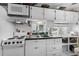 Galley kitchen featuring white appliances, dark counters, and ample cabinet space at 6001 - 1789 S Kings Hwy., Myrtle Beach, SC 29575