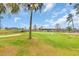 Scenic golf course view featuring lush green fairways, a sand trap, geese, and a serene water feature at 703 Riverwalk Dr. # 304, Myrtle Beach, SC 29579