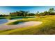 Rolling greens and sand traps of a golf course at 7060 Belancino Blvd., Myrtle Beach, SC 29572