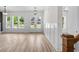 Bright and airy living room showcasing hardwood floors and a view of the entryway at 8001 Mcsweeney Ct., Myrtle Beach, SC 29588