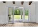 Covered patio with brick fireplace and sliding glass doors at 8001 Mcsweeney Ct., Myrtle Beach, SC 29588