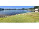 Picturesque backyard featuring a tranquil lake view and lush green lawn at 8830 Chandler Dr. # G, Surfside Beach, SC 29575