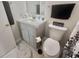 Bathroom featuring a toilet, vanity with modern fixtures and updated tile flooring at 8830 Chandler Dr. # G, Surfside Beach, SC 29575