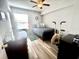Bedroom featuring a ceiling fan, bed, wood-look flooring, desk and other furniture at 8830 Chandler Dr. # G, Surfside Beach, SC 29575