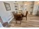 Intimate dining area featuring a wood table with seating for four and natural light at 8830 Chandler Dr. # G, Surfside Beach, SC 29575
