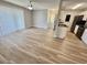 Open floor plan with modern flooring, access to kitchen, and sliding doors to outdoor space at 8830 Chandler Dr. # G, Surfside Beach, SC 29575