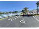 Handicap parking access and a view of the serene lakefront and community pool at 8830 Chandler Dr. # G, Surfside Beach, SC 29575