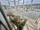 Relaxing screened patio with wicker furniture overlooking a serene pond and well-manicured lawn at 8830 Chandler Dr. # G, Surfside Beach, SC 29575