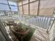 Enclosed patio featuring comfortable seating and tranquil water view, enhancing outdoor living at 8830 Chandler Dr. # G, Surfside Beach, SC 29575