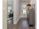 Bright entryway with dark hardwood floors and a decorative console table at 1024 Quail Roost Way, Myrtle Beach, SC 29588