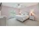 Bedroom featuring neutral carpet, French doors leading to a balcony, and coordinated bedside tables at 118A 6Th Ave. N, Surfside Beach, SC 29575