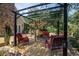Outdoor deck area with a pergola, comfortable seating, and a serene backyard setting at 1716 Club Circle Dr., Pawleys Island, SC 29585