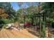 Inviting backyard featuring a pergola, comfortable seating, and lush landscaping at 1716 Club Circle Dr., Pawleys Island, SC 29585