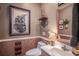 Charming powder room featuring decorative art, unique light fixture, and a stylish vanity area at 1716 Club Circle Dr., Pawleys Island, SC 29585