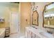 Bathroom with double sink vanity, chandelier, and mosaic tile backsplash at 1716 Club Circle Dr., Pawleys Island, SC 29585