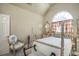 Bedroom featuring vaulted ceilings, arched window, and four poster bed at 1716 Club Circle Dr., Pawleys Island, SC 29585
