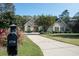 Beautiful home with a long driveway, mature trees, and inviting curb appeal at 1716 Club Circle Dr., Pawleys Island, SC 29585