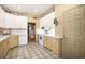 Traditional kitchen with white cabinets, light countertops, and tile flooring at 1716 Club Circle Dr., Pawleys Island, SC 29585