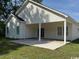 Backyard with a covered patio and concrete slab and green grass under blue skies at 3162 Wayside Rd., Conway, SC 29527