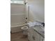 New bathroom featuring a white tub, toilet, vanity with granite counters, and black fixtures at 3162 Wayside Rd., Conway, SC 29527