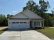 Inviting exterior showcasing a charming home with a two-car garage and a well-maintained lawn at 3162 Wayside Rd., Conway, SC 29527