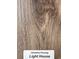 Close-up showcasing Shoreline 'Light House' wood-style flooring with intricate grain details at 3162 Wayside Rd., Conway, SC 29527